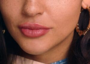 A close up of the lips and nose of a woman